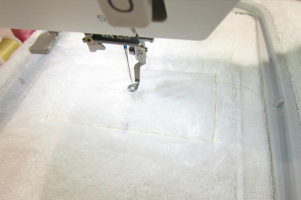 Enfile-aiguille automatique de la Janome Memory Craft 500e