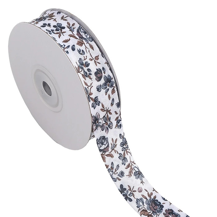 Biais replié 25mm blanc à fleurs grises au mètre Biais replié 25mm blanc à fleurs grises au mètre